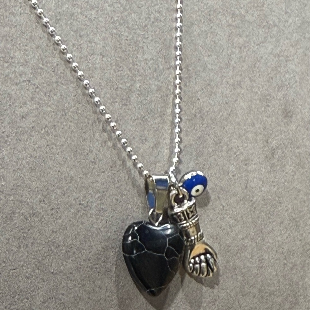 Silver Lucky Necklace with black Heart, evil eye bead and Hand Charms